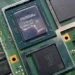 GPU Nintendo Switch 2 - Close-up of Nvidia GPU on Nintendo Switch 2 motherboard, showing graphics processor and memory chips on a green PCB.