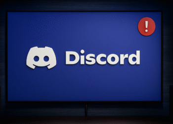 Error No Route en Discord - Discord logo on a blue screen with a red exclamation notification badge, suggesting a chat app alert or issue on a desktop monitor.