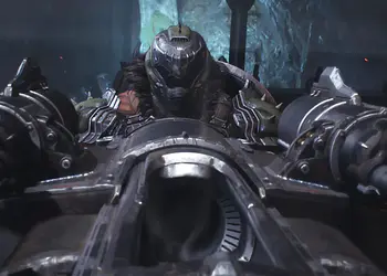 Armas de Doom The Dark Ages: el Doom Slayer apunta cañones dobles desde una máquina de asedio en un entorno oscuro y cavernoso.
